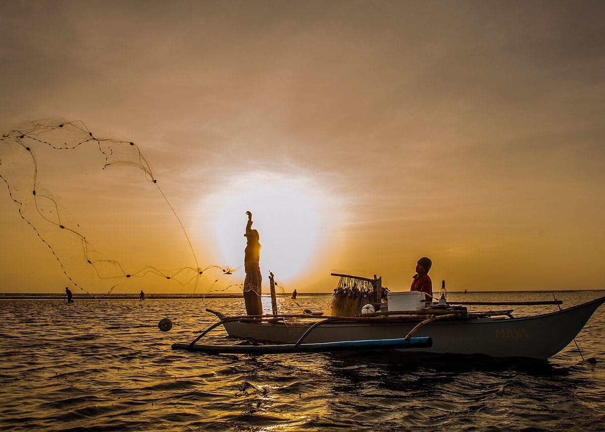 Fiskere i solnedgangen